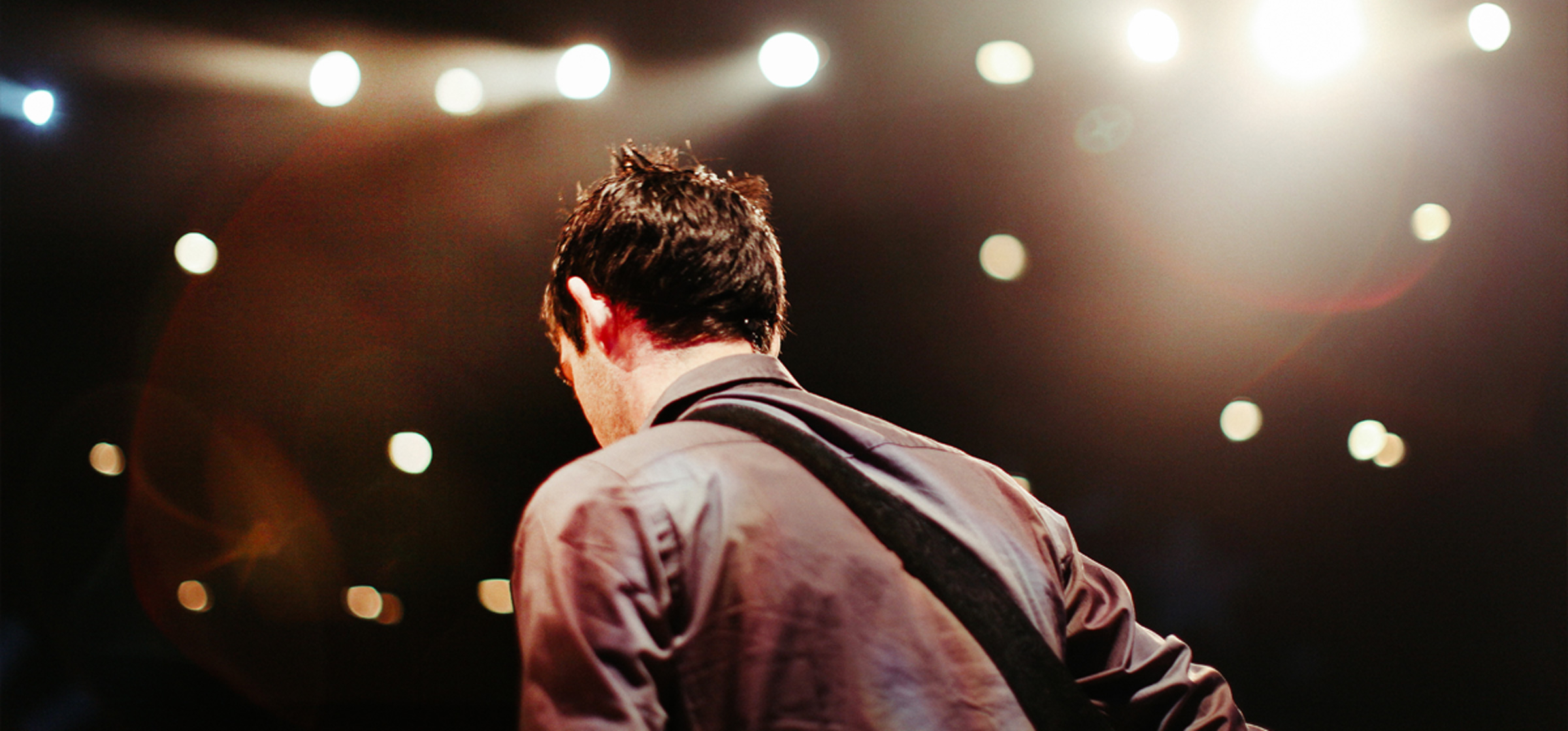 Man playing guitar on stage