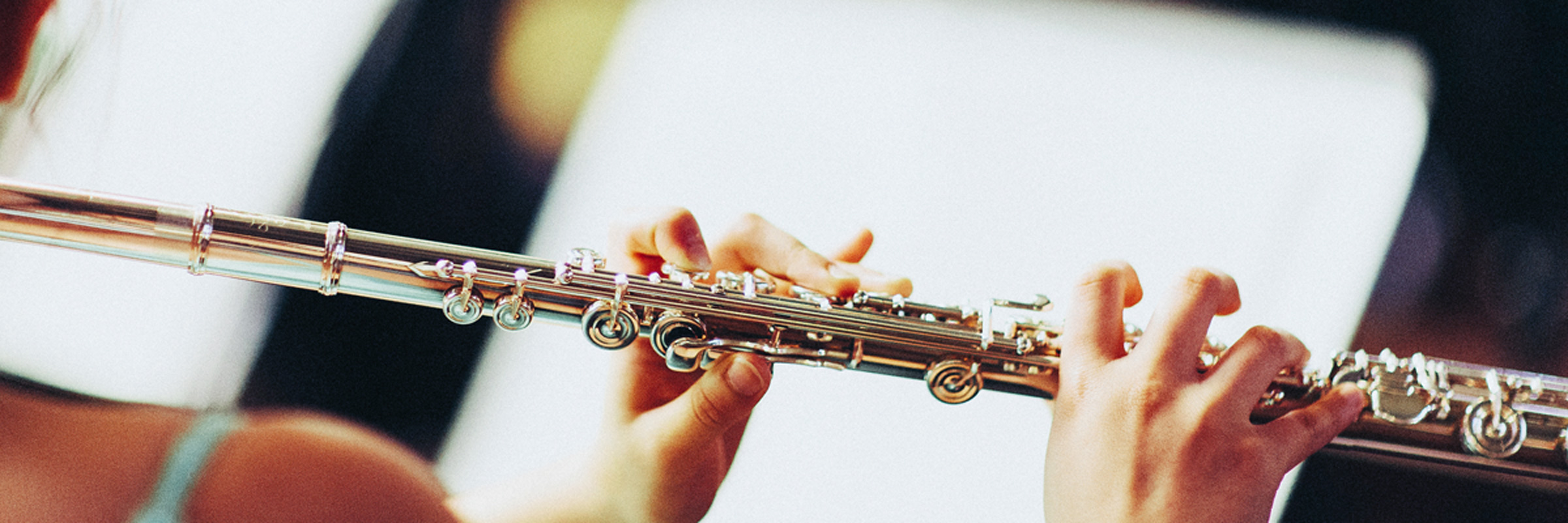 Girl reading music and playing flute